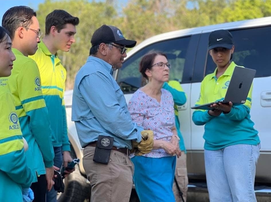 Robert Rizo assisting with the ASEZ WAO Blanco River Clean-Up in San Marcos
